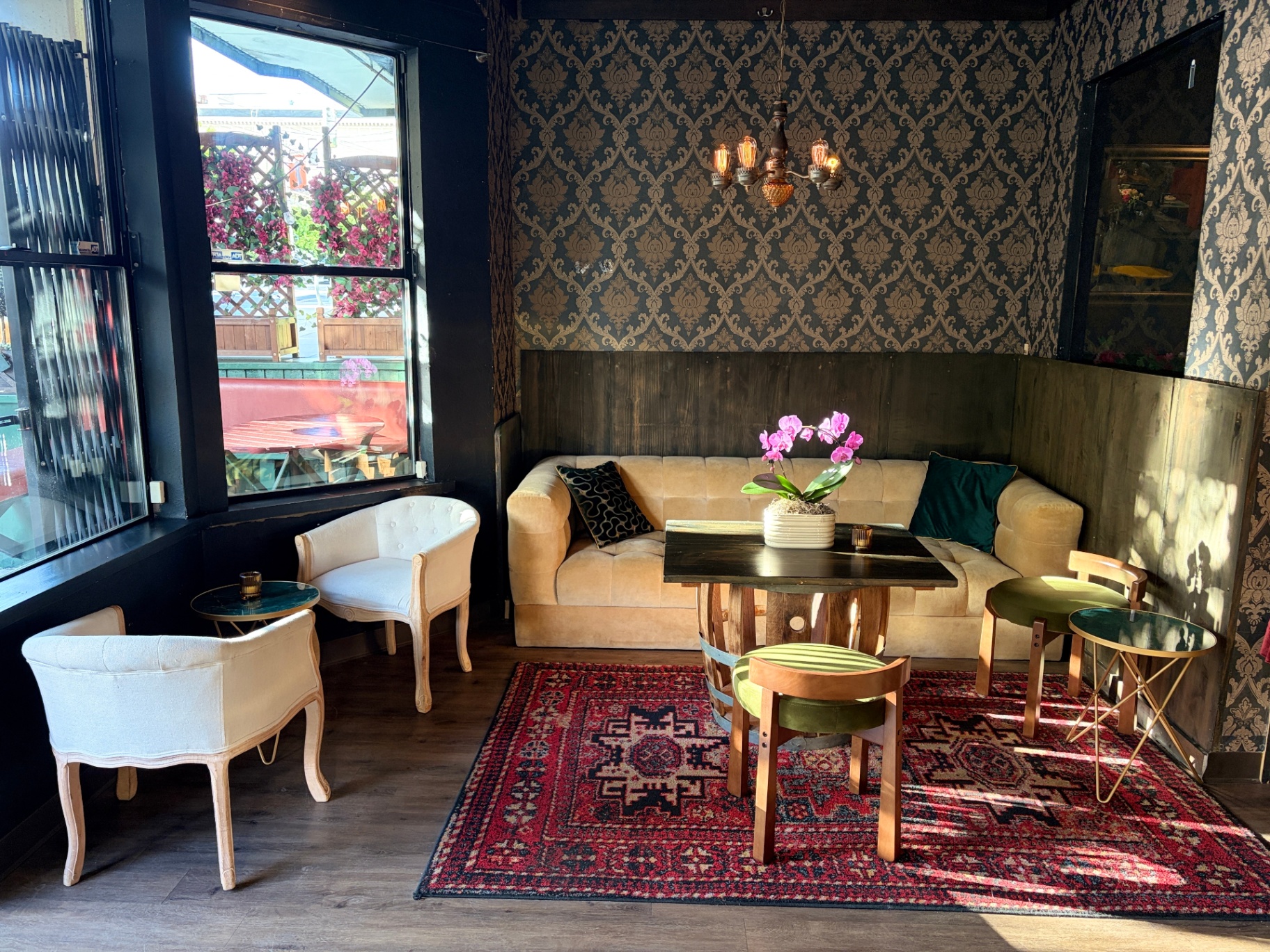 Cream banquette and white chairs by the window at Flying Figs